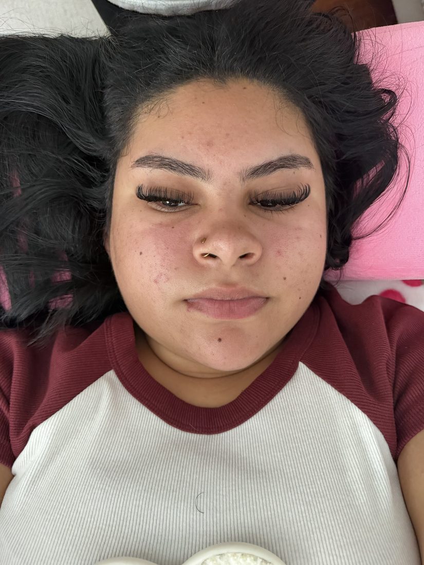 Full lash extension set on a client, photographed from above on the lash bed